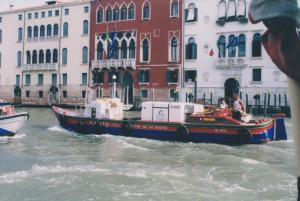 The delivery boat chugs along the canals
