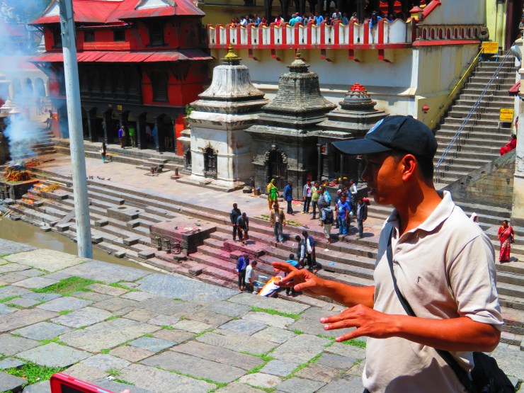 Our fabulous guide Nabin, explains the funeral proceedings at the Kathmandu sacred cremation site.