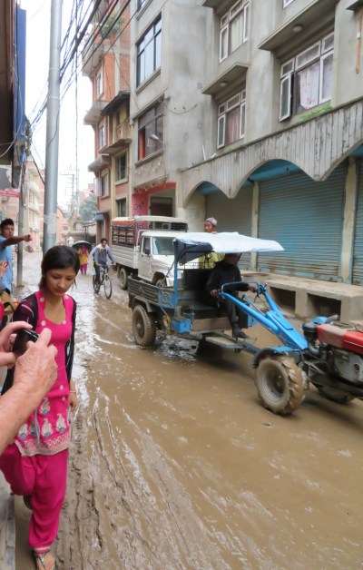 Navigating the muddy streets of Patan.