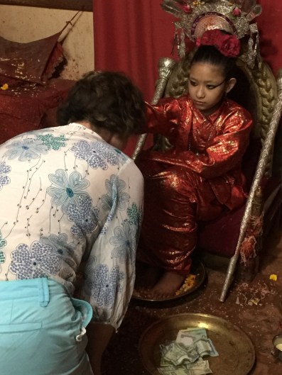 Receiving a blessing from the Living Goddess,