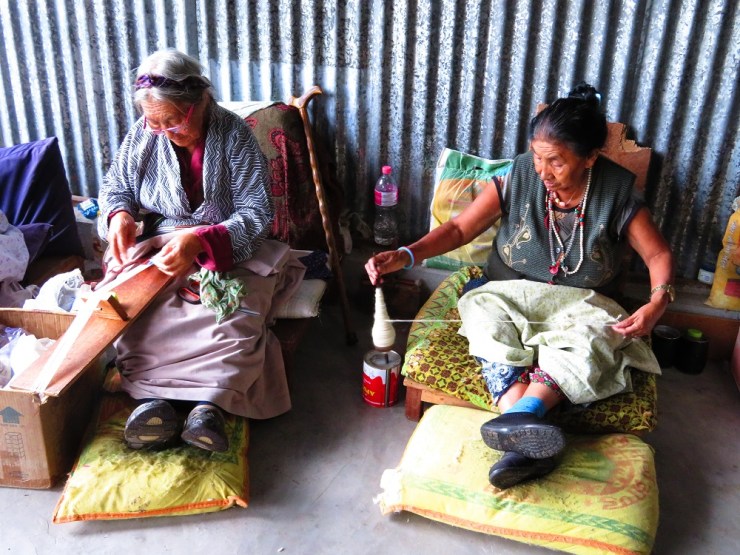 Tibetan refugees spin and weave
