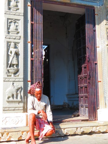 An old man waits at the door of temple, Udaipur.