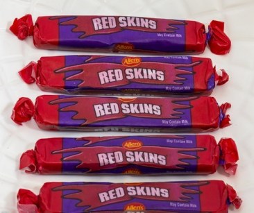 five red skin lollies or sweets