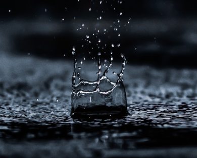 a large rain drop splashes