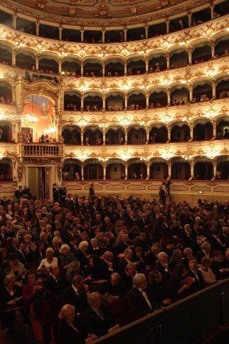Internal view of Teatro municipale Piacenza at night with audience