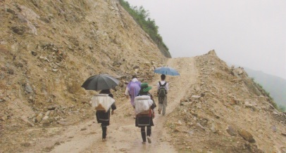 Four people Hiking in Sapa in the rain and mud