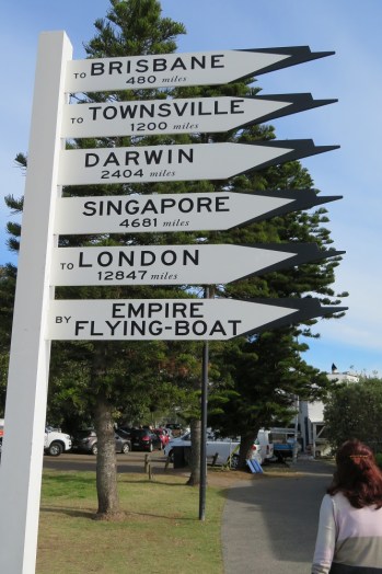 A sign showing directions to major cities by flying boat