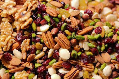  A close up photo of trail mix nuts and cranberries. Photo by Maksim Shutov on Unsplash