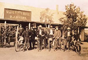 A group of old men outside the White Cliffs Hotel. whitecliffscopal.com