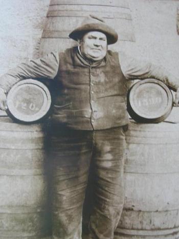 Fatty Appleton holds two large beer kegs under each arm - cascade brewery