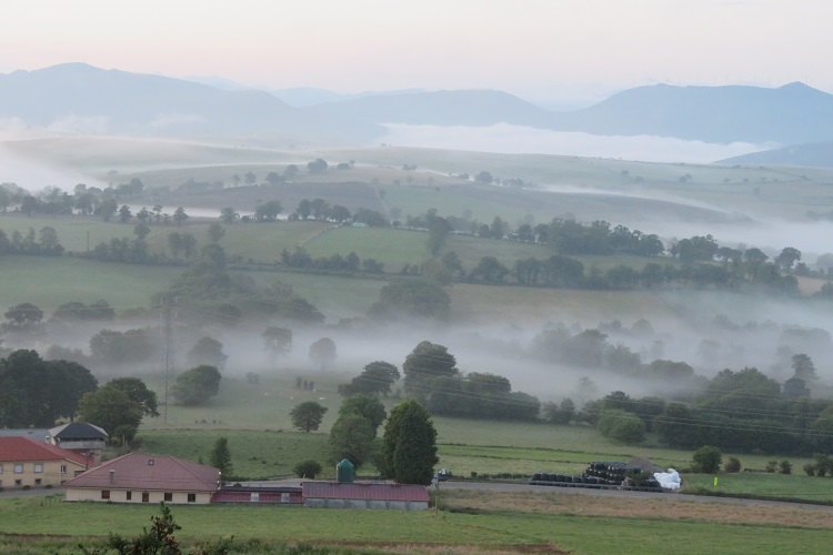 Rolling hills and misty views on the Camino Primitivo, Spain