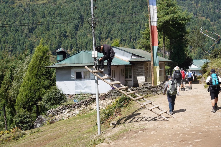 An electrician at work  in the Himalayas