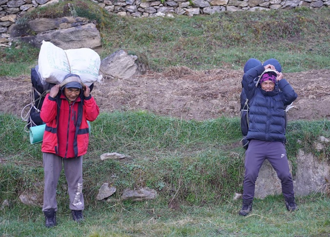 Porters loading our bags before departing Kyangjuma