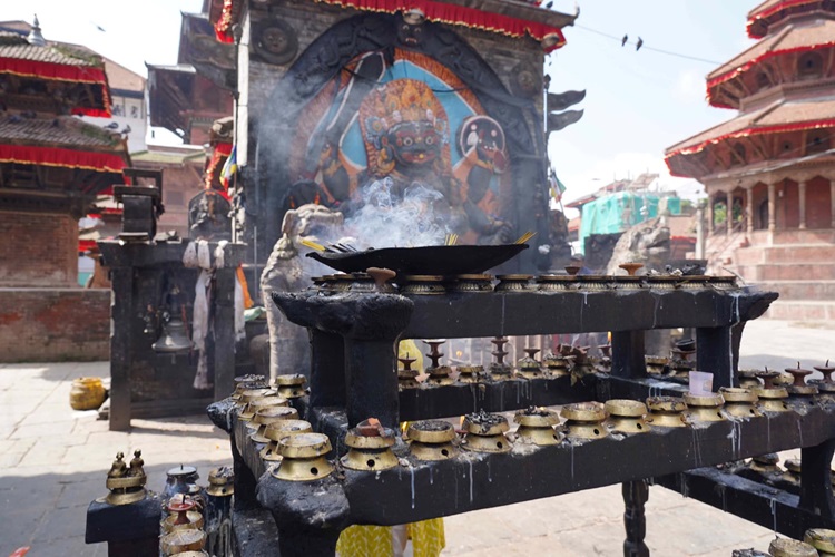 Making an offering in the Square, Kathmandu. Photo: The Husband