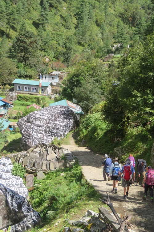 Walking down towards A prayer rock in the Himalayas